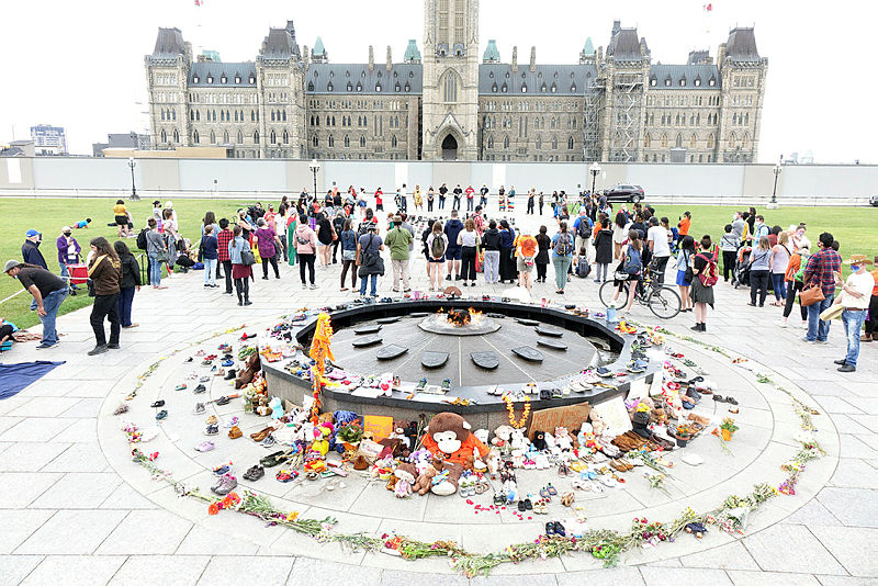||Dozens gathered near Centennial Flame on Parliament Hill at a June 3, 2021, event to honour the 215 children whose remains were found on the grounds of the Kamloops Indian Residential School in B.C. The Hill Times photograph by Sam Garcia