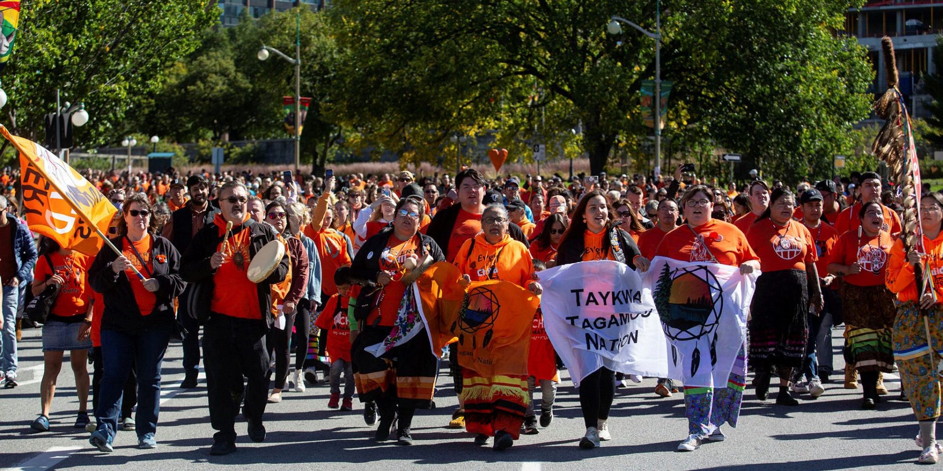 Marchers walk down Wellington Street for the National Truth and Reconciliation Day ceremonies in Ottawa on Sept. 30. The Hill Times photograph by Andrew Meade