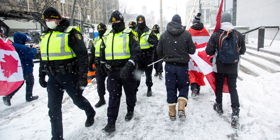 Ontario Provincial Police patrol Wellington Street on Feb. 12, 2022 as the Freedom convoy’s occupation of  downtown Ottawa enters the third weekend.