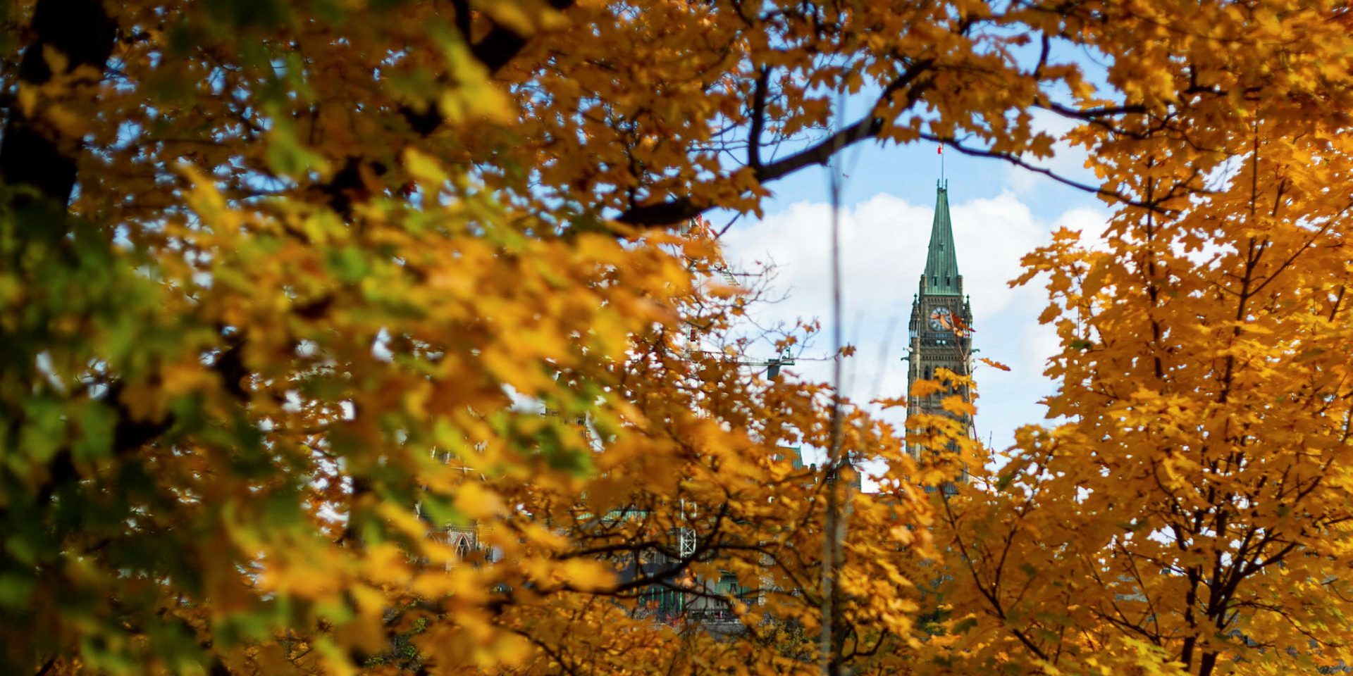 Colourful foliage frames the Peace Tower from Portage Bridge on Oct. 20, 2022. The Hill Times photograph by Andrew Meade