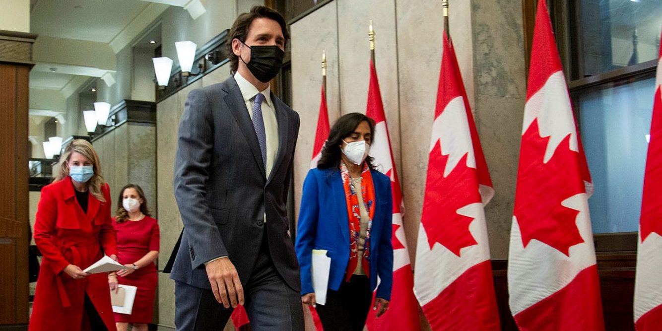 Prime Minister Justin Trudeau, Defence Minister Anita Anand, right, Foreign Minister Mélanie Joly, left, and Finance Minister Chrystia Freeland leave a media availability in West Block on Jan. 26, 2022.  Andrew Meade