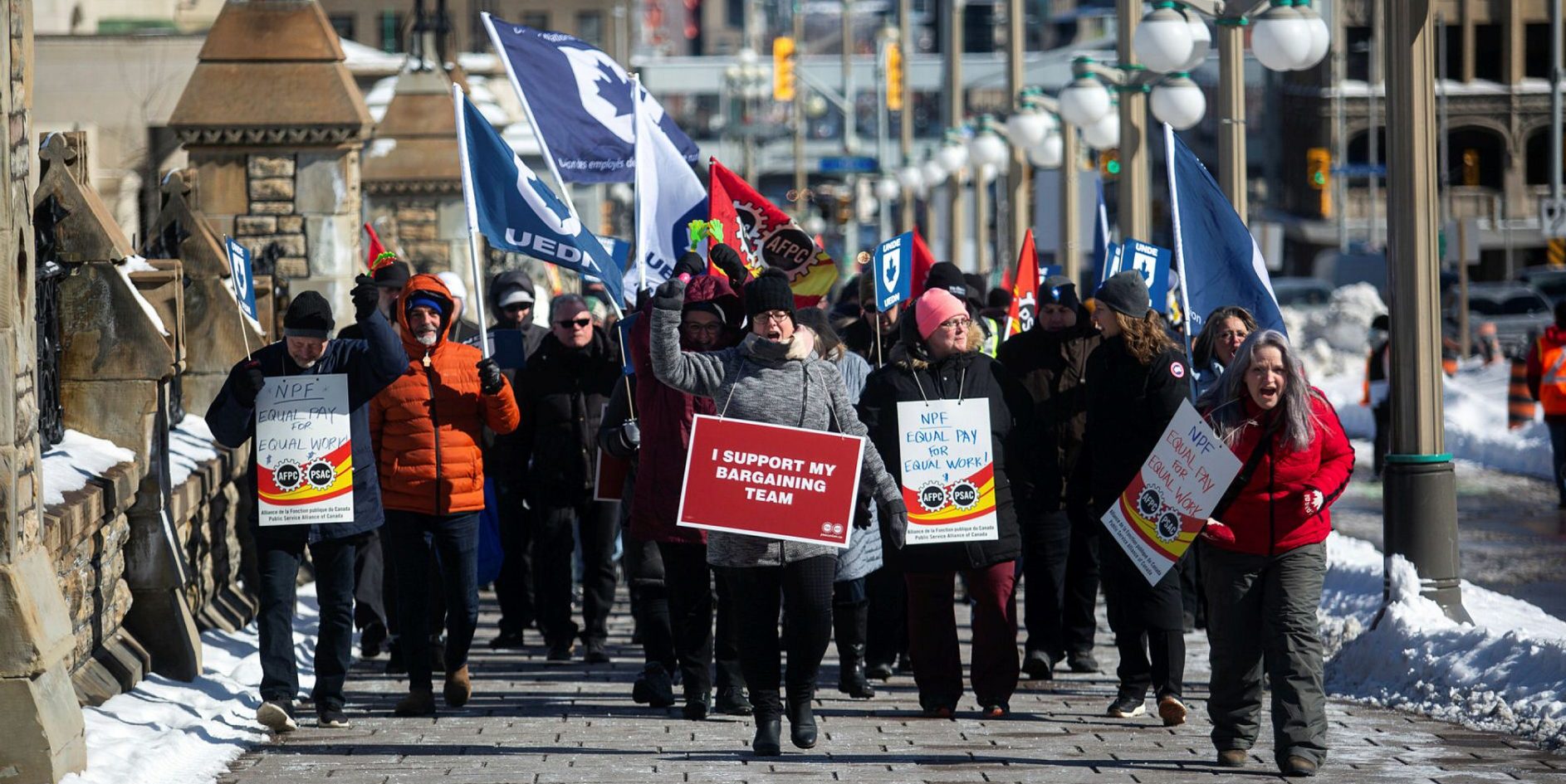 Members of Public Service Alliance of Canada locals hold a demonstration outside the Prime Minister’s Office on Feb. 24, 2023. The Hill Times photograph by Andrew Meade