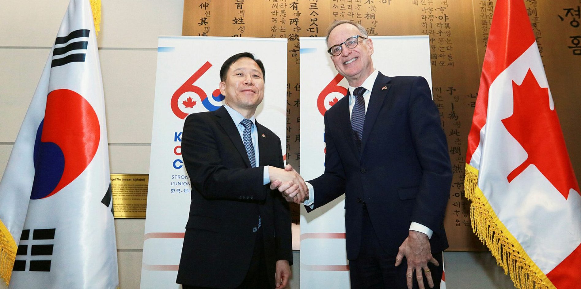 Korean Ambassador Woongsoon Lim, left, and Liberal MP Robert Oliphant at an event to mark the 60th anniversary of diplomatic relations between Korea and Canada at the Korean Embassy on Jan. 12.  Sam Garcia