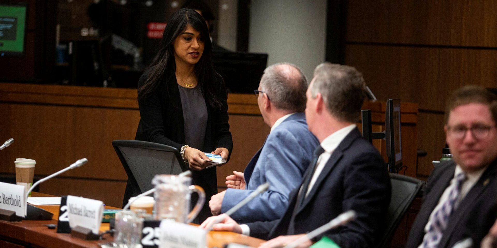 Liberal MP Bardish Chagger, left, speaks with Conservative MP Luc Berthold before the Standing Committee on Procedure and House Affairs meeting in West Block on March 21 to continue the committee’s study on foreign election interference. The Hill Times photograph by Andrew Meade