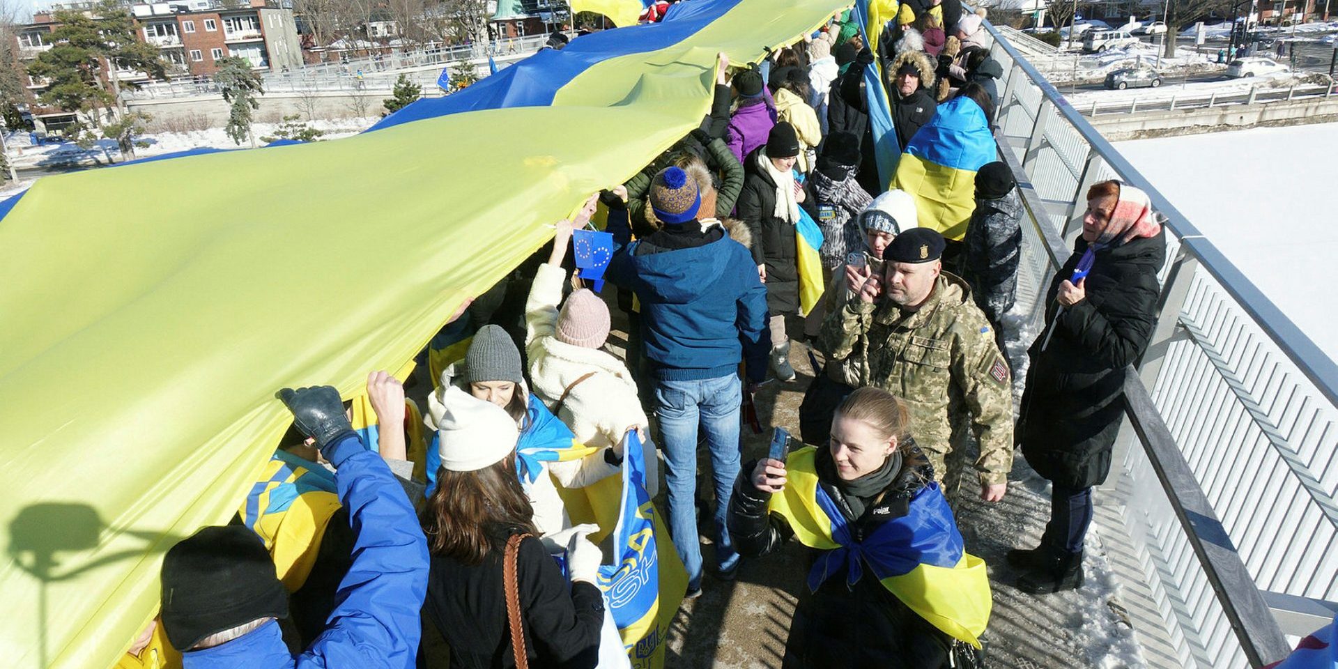 The Flora Footbridge was filled with supporters for the Stand With Ukraine rally on Feb. 20 The Hill Times photograph by Sam Garcia