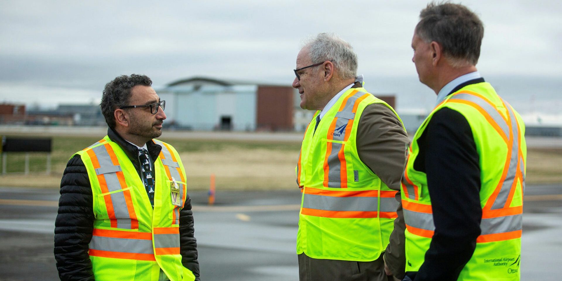 Transport Minister Omar Alghabra, left, makes an announcement with Liberal MP David McGuinty, right, and Mark Laroche, Ottawa Airport Authority president and CEO, at the Ottawa Macdonald-Cartier International Airport on Nov. 28, 2022. The Hill Times photograph by Andrew Meade