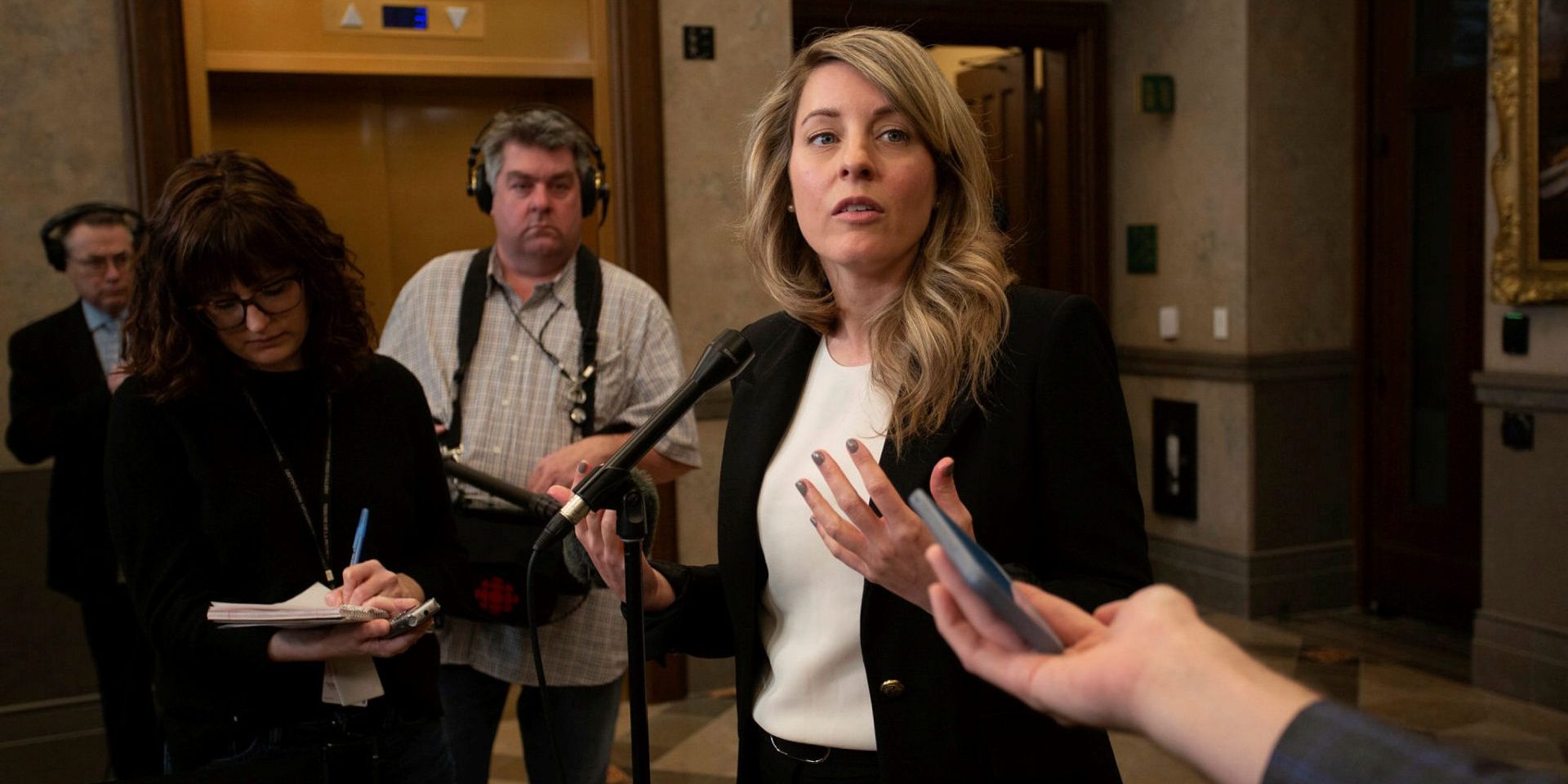 Minister of Foreign Affairs Mélanie Joly speaks with reporters outside the House of Commons before Question Period on  March 27, 2023, about Israel. Andrew Meade