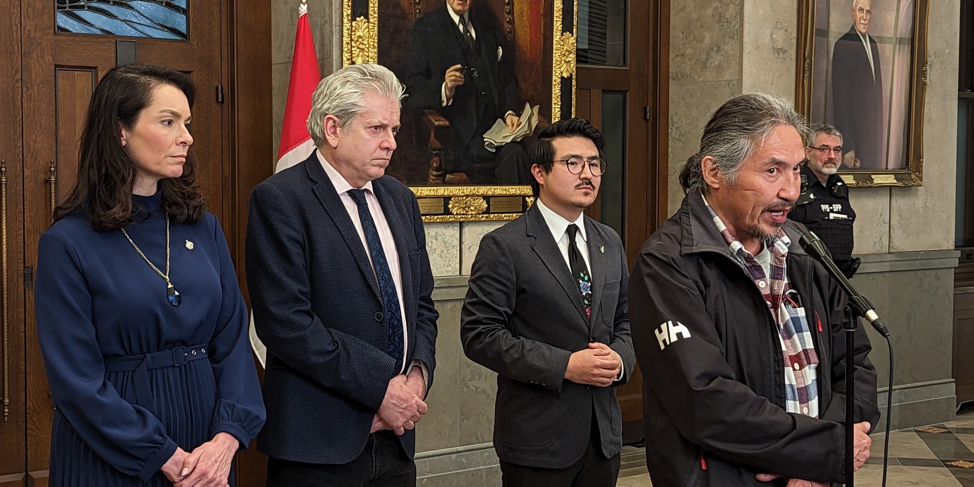 Chief Allan Adam of the Athabaska Chipewyan First Nation speaks to reporters on April 17, 2023, alongside NDP MPs Charlie Angus, Heather McPherson, and Blake Desjarlais. The Hill Times photograph by Kevin Philipupillai