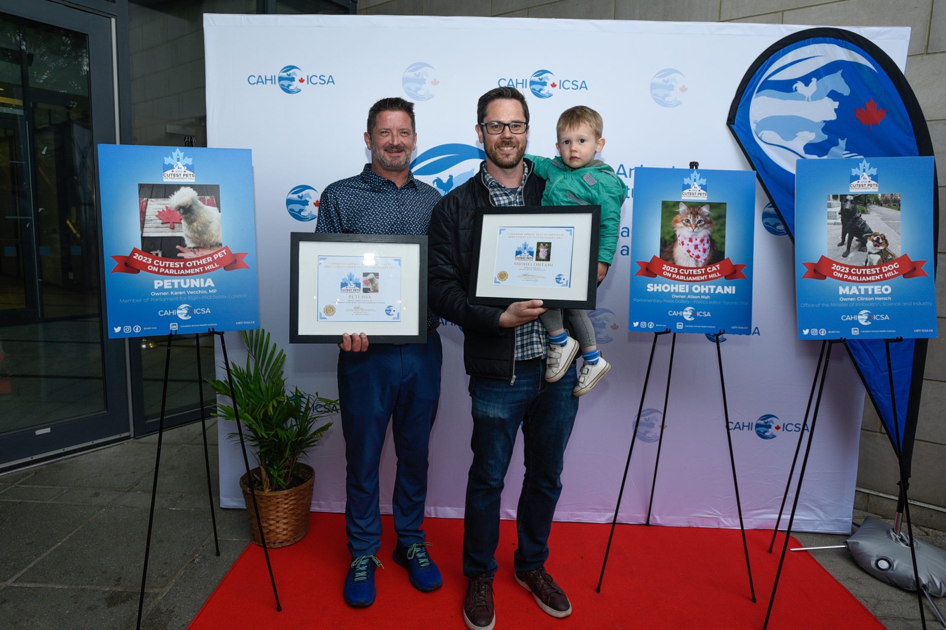 Mike Vecchio, owner of Petunia the Silkie Chicken, and Bill Platt, who accepted the award for cat Shohei Ohtani on behalf of the Toronto Star's Alison Mah.