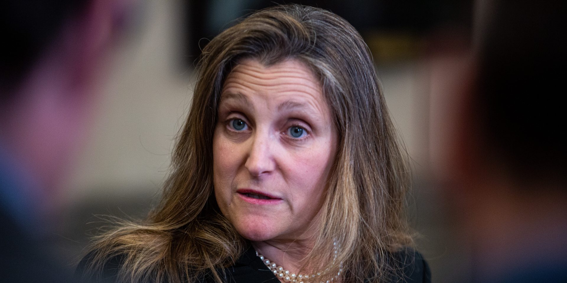 Minister of Finance Chrystia Freeland scrums with reporters after the Liberal party caucus meeting in West Block  on May 17, 2023, to answer questions abut the dispute over the Stellantis facility in Windsor. The Hill Times photograph by Andrew Meade