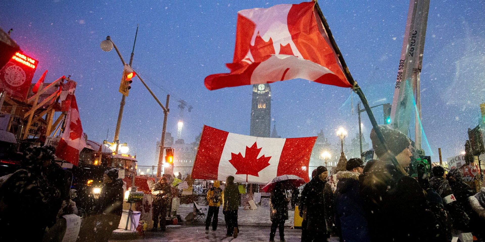 Freedom Convoy supporters gather along Wellington Street on Feb. 17, 2022 as the convoy’s occupation of downtown Ottawa enters the third week.