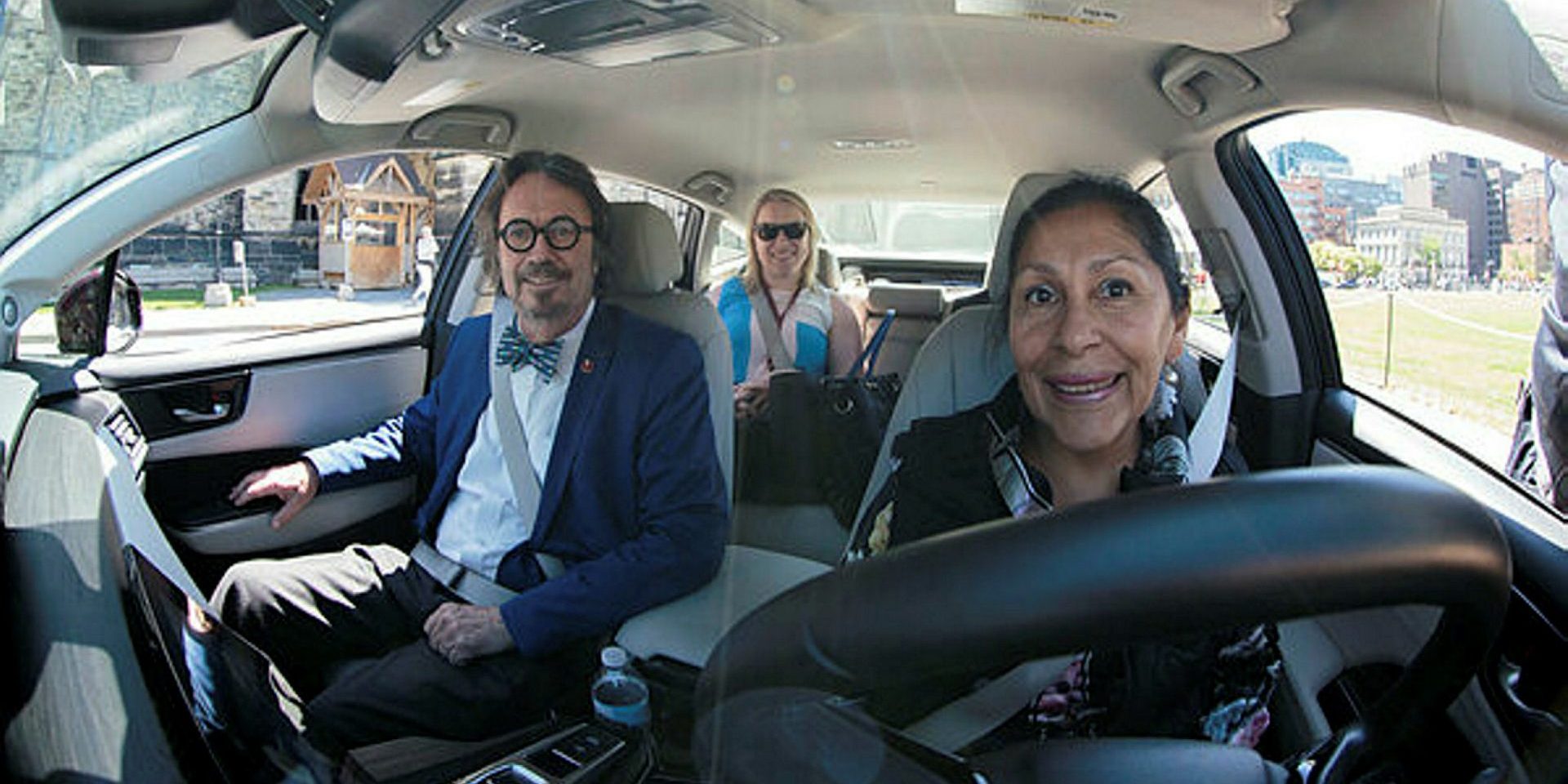 Quebec Senators Dennis Dawson and Rosa Galvez, pictured on June 7, 2017, testing out an electric car that uses hydrogen power cells to drive.