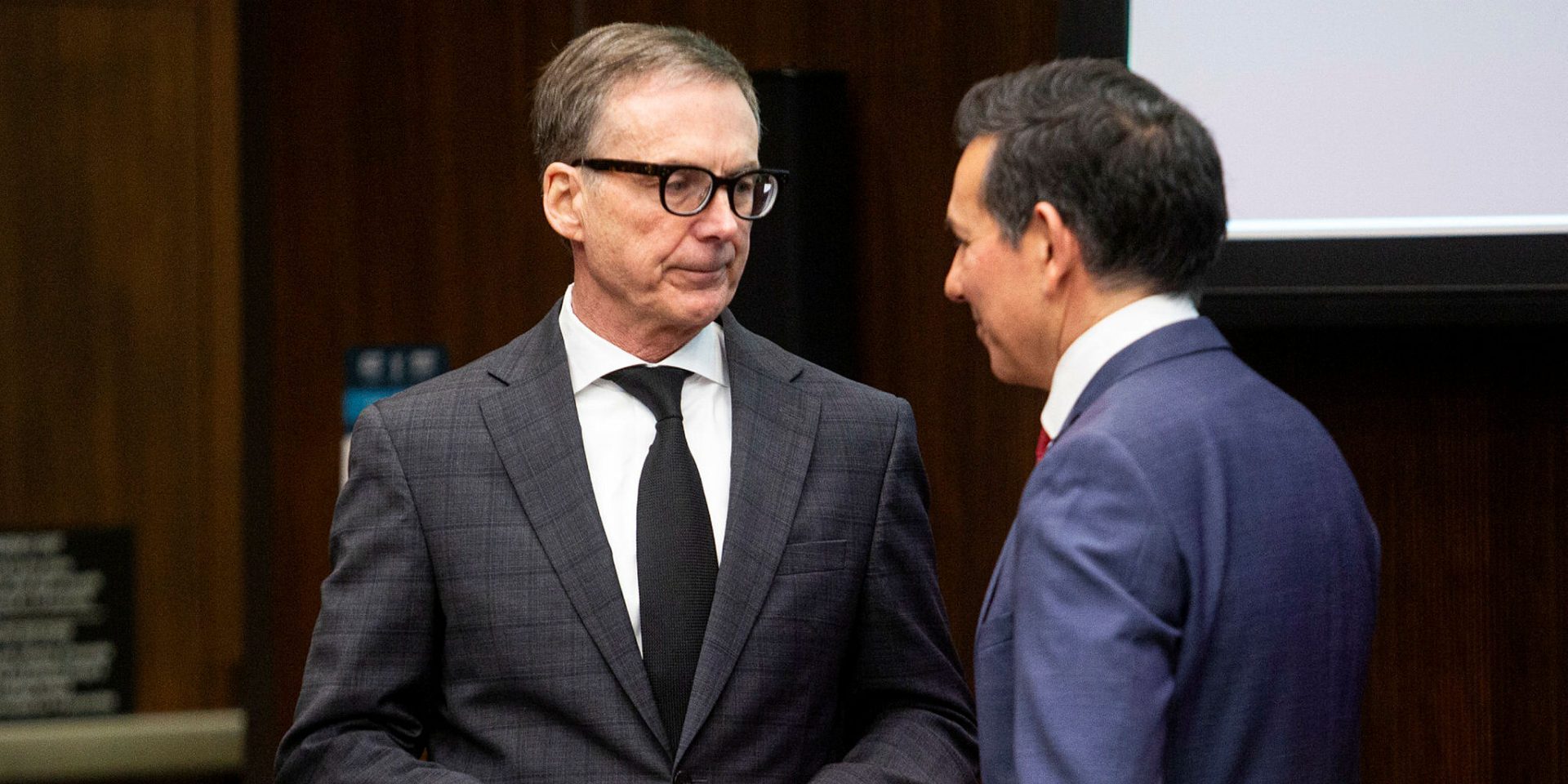 Bank of Canada Governor Tiff Macklem speaks with committee chair Peter Fonseca before appearing at the House of Commons Standing Committee on Finance on  Feb. 1, 2024.