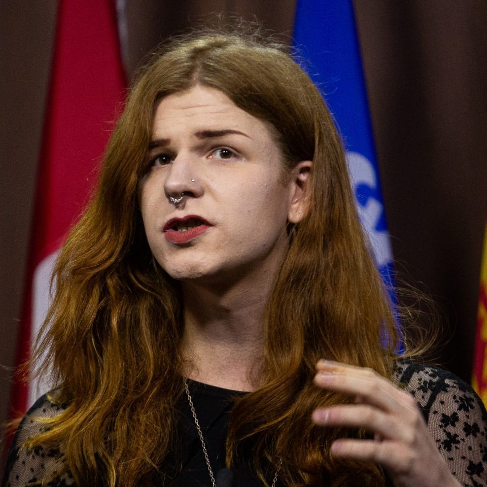 Trans rights activist Fae Johnstone speaks at a press conference in West Block on Nov. 20, 2023, to call on the government to ensure protection of the rights of trans people and children.