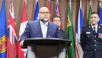 Todd Doherty, left, Conservative addictions critic, on Dec. 9 spoke during a press conference about the need to fast-track a bill legislating more serious criminal sentences for assaults against health care workers and first responders. Also at the media event in the West Block were Conservative health critic Dan Mazier, centre, and Pierre Poirier, chief of the Ottawa Paramedic Service. The Hill Times photograph by Tessie Sanci