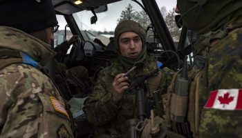 Master Corporal (MCpl) Gould (center), provides direction for Private (Pte) Broder and a member of the United States Army during a resupply run on Exercise (Ex) IRON SWORD in Silvestras Zukauskas Pabrade Training Area, Lithuania, during Operation REASSURANCE on November 30, 2016.

 

Image By: Cpl Jay Ekin,

Operation REASSURANCE Land Task Force Imagery Technician