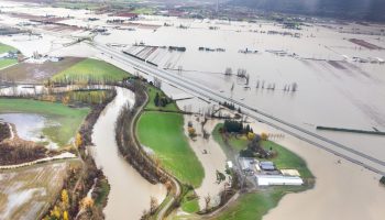 Lana Popham, Minister of Agriculture, Food and Fisheries, MLAs Ian Paton and Pam Alexis, witness the flood devastation over Abbotsford and Chilliwack BC, November 23, 2021. Photograph courtesy of the Province of B.C./Flickr