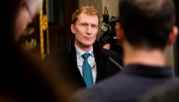 Minister of Immigration, Refugees and Citizenship Marc Miller speaks with reporters in the House of Commons foyer before Question Period on  Nov. 22, 2023.