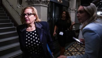 Minister of Immigration Refugees and Citizenship Lena Diab walks past reporters before the Liberal cabinet meeting in West Block on  Sept. 16, 2025. Hill Times photograph by Andrew Meade