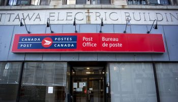 Notices are posted at a Canada Post office on Sparks Street in Ottawa on  Nov. 15, 2024, after the union was locked out by its employer after delivering a 72 hour strike notice earlier in the week. The Hill Times photograph by Andrew Meade