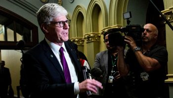 Minister of Energy and Natural Resources Tim Hodgson arrives for a meeting of the National Security Council in West Block on June 13, 2025. The Hill Times photograph by Andrew Meade