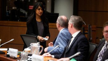 Liberal MP Bardish Chagger, left, speaks with Conservative MP Luc Berthold before the Standing Committee on Procedure and House Affairs meeting in West Block on March 21 to continue the committee’s study on foreign election interference. The Hill Times photograph by Andrew Meade