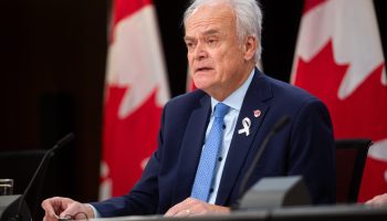 Senator Peter Boehm holds a press conference in the National Press Theatre on  Dec. 6, 2023, after the Senate Committee on Foreign Affairs and International Trade’s release of  its report on the Canadian foreign service and elements of the foreign policy machinery within Global Affairs Canada. The Hill Times photograph by Andrew Meade