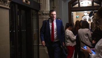 Minister of Artificial Intelligence and Digital Innovation and Minister responsible for the Federal Economic Development Agency for Southern Ontario Evan Solomon arrives for the Liberal party caucus meeting in West Block  on Oct. 8, 2025.