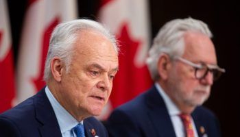 Senator Peter Boehm holds a press conference in the National Press Theatre on  Dec. 6, 2023, after the Senate Committee on Foreign Affairs and International Trade’s release of  its report on the Canadian foreign service and elements of the foreign policy machinery within Global Affairs Canada. The Hill Times photograph by Andrew Meade