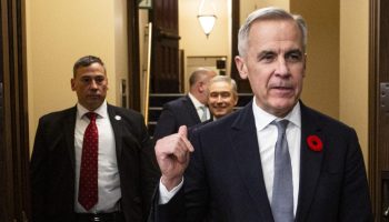 Prime Minister Mark Carney and Minister of Finance and National Revenue François-Philippe Champagne take the 2025 budget into the House of Commons to table iton  Nov. 4, 2025. The Hill Times photograph by Andrew Meade