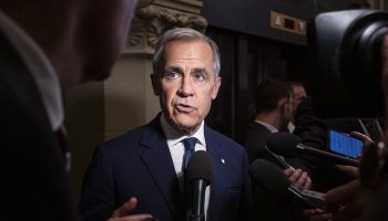 Prime Minister Mark Carney speaks with reporters outside the Liberal party caucus meeting from West Block  on June 4, 2025. The Hill Times photograph by Andrew Meade