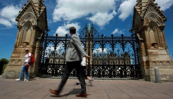 Pedestrians walk past the gates to Parliament Hill on July 13, 2022. Andrew Meade