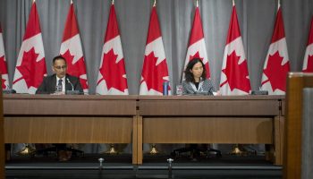 Canada's chief public health officer Theresa Tam, pictured with her deputy, Howard Njoo, on March 24, says community transmission of COVID-19 is now the main source of infection in the country. The Hill Times photograph by Andrew Meade