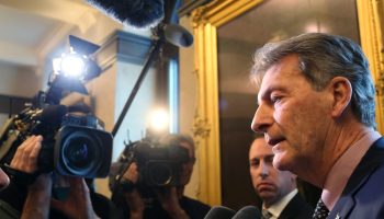 Liberal MP John McKay speaks with reporters in the West Block House of Commons foyer during a marathon vote session on Mar. 21, 2019. The Conservatives brought 257 pieces of legislation from the Interim Estimates to the floor to be voted on in protest to the Liberals' stopping further proceedings around the SNC-Lavalin affair in the House standing committee on Justice and Human rights. The Hill Times photograph by Andrew Meade