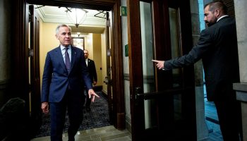 Prime Minister Mark Carney arrives in the House of Commons foyer before Question Period on June 10, 2025. The Hill Times photograph by Andrew Meade