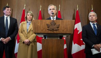 Prime Minister Mark Carney holds a press conference in West Block on  June 19, 2025. Left to right: Minister responsible for Canada-U.S. Trade Dominic LeBlanc, Industry Minister Mélanie Joly, Prime Minister Mark Carney and Finance Minister François-Philippe Champagne.  The Hill Times photograph by Andrew Meade.