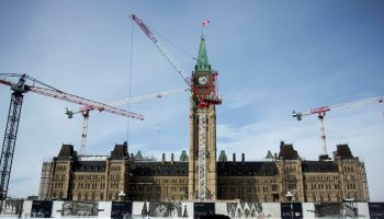 Centre Block is pictured  on a snowy winter day in downtown Ottawa on Feb. 18, 2025. The Hill Times photograph by Andrew Meade