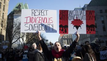 Demonstrators supporting the Wetʼsuwetʼen nation against the building of the Costal Gasoline pipeline through their traditional territory march through downtown Ottawa on February 24 2020.
Signs read "Respect Indigenous sovereignty" and "Reconciliation, wreckonciliation" The Hill Times photograph by Andrew Meade