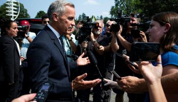 Prime Minister Mark Carney scrums with reporters as he leaves the Metis Major Projects Summit in Ottawa on Aug. 7,  2025. The Hill Times photograph by Andrew Meade