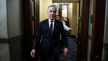 Prime Minister Mark Carney enters the House of Commons foyer before Question Period on  Feb. 10, 2026. The Hill Times photograph by Andrew Meade
