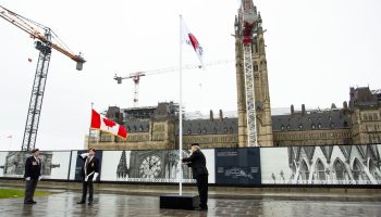 Veterans raise the Royal Canadian Legion’s Poppy flag on Parliament Hill on  Oct. 31, 2025. The Hill Times photograph by Andrew Meade