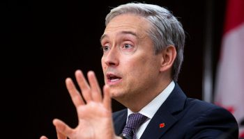 Minister of Innovation, Science and Industry François-Philippe Champagne  speaks at a press conference at the National Press Theatre in Ottawa on  Oct. 5, 2023, to speak with reporters about a number of initiatives to affect the cost of living crisis. Andrew Meade
