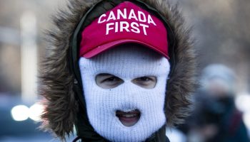 A group of Groypers, white nationalists conservative provocateurs, taunt a counter protest gathered at Ottawa City Hall on Feb. 5, 2022 as the Freedom Convoy occupation of downtown Ottawa enters the second week. The Hill Times photograph by Andrew Meade