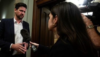 Minister of Housing, Infrastructure and Communities Sean Fraser speaks with reporters before the Liberal party caucus meeting in West Block on Nov. 29, 2023.