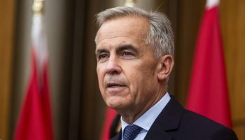 Prime Minister Mark Carney holds a press conference in the National Press Theatre on July 30, 2025. The Hill Times photograph by Andrew Meade