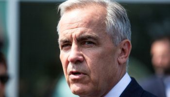 Prime Minister Mark Carney scrums with reporters as he leaves the Metis Major Projects Summit in Ottawa on Aug. 7,  2025. The Hill Times photograph by Andrew Meade