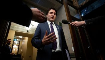 Prime Minister Justin Trudeau speaks with reporters in the House of Commons foyer before Question Period on  Dec. 6, 2023.