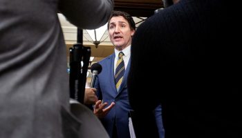 Prime Minister Justin Trudeau speaks with reporters in the House of Commons foyer before Question Period on  Dec. 13, 2023.