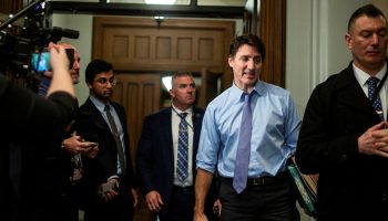 Prime Minister Justin Trudeau speaks with reporters after the Liberal party caucus meeting from West Block  on Jan. 31, 2024.