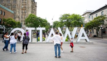Tourists take photographs with the Ottawa is in the Byward Market on Aug. 15, 2023. Andrew Meade